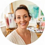 Art instructor Mara O'Connell smiling in a bright Dublin painting studio
